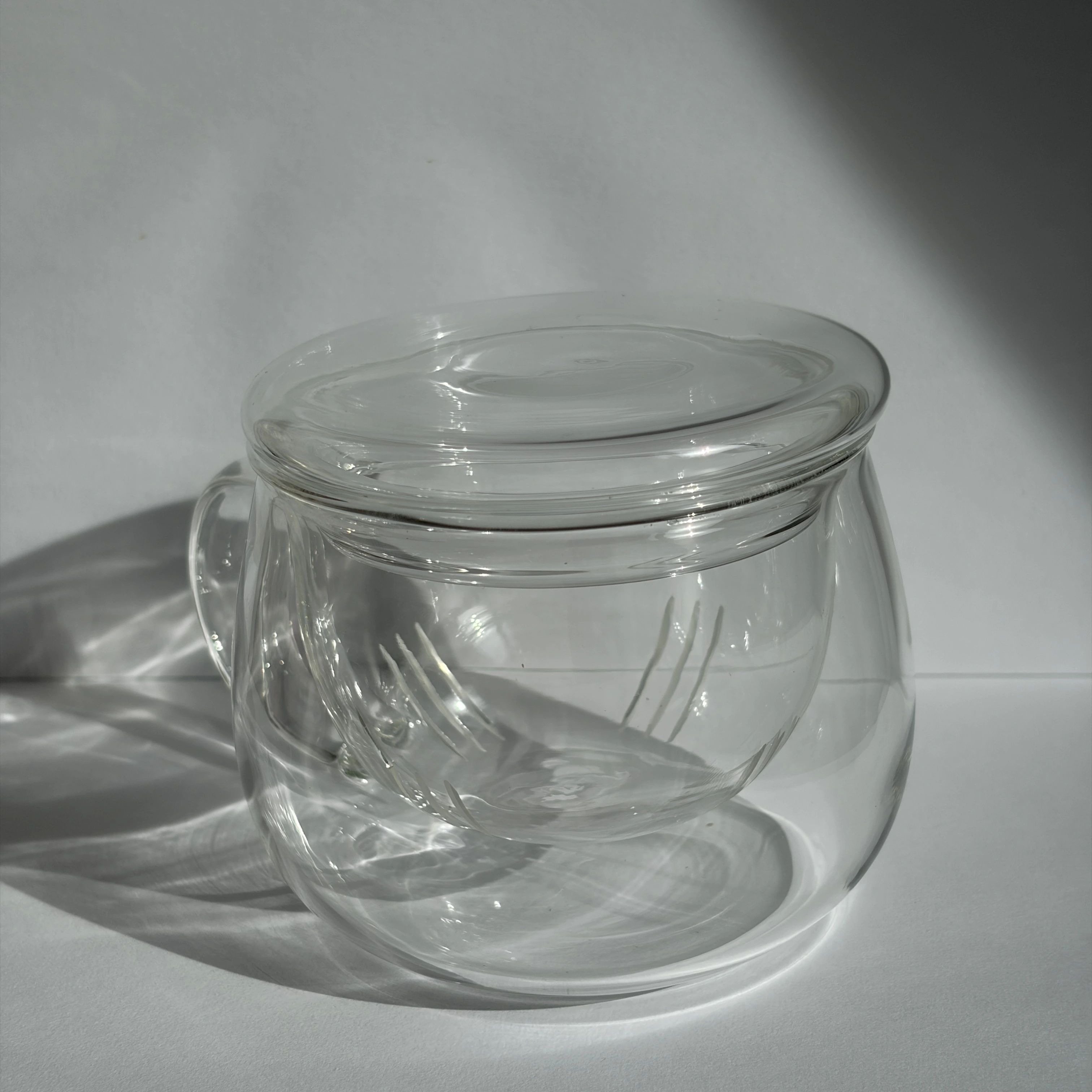 Glass tea cup with infuser and lid