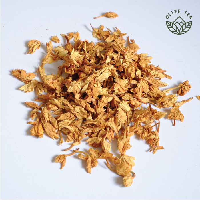 Fresh jasmine flowers with tea leaves