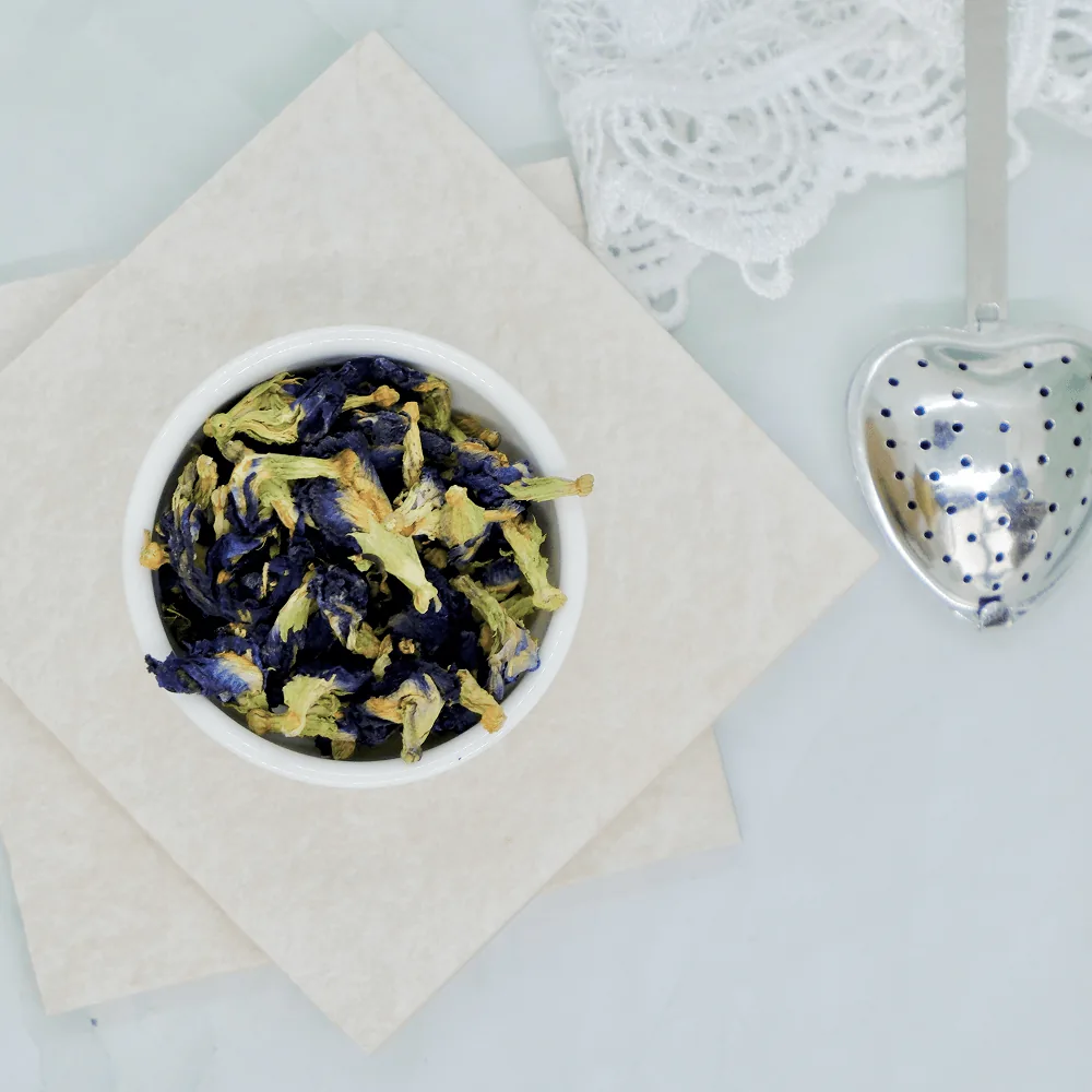 Dried butterfly pea flowers and the deep blue infusion they brew