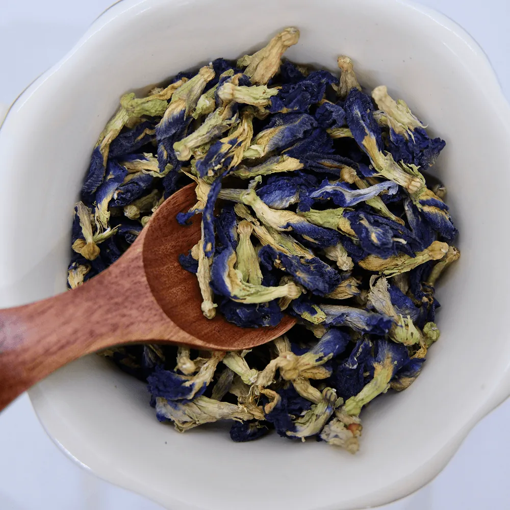Dried butterfly pea flowers and the deep blue infusion they brew
