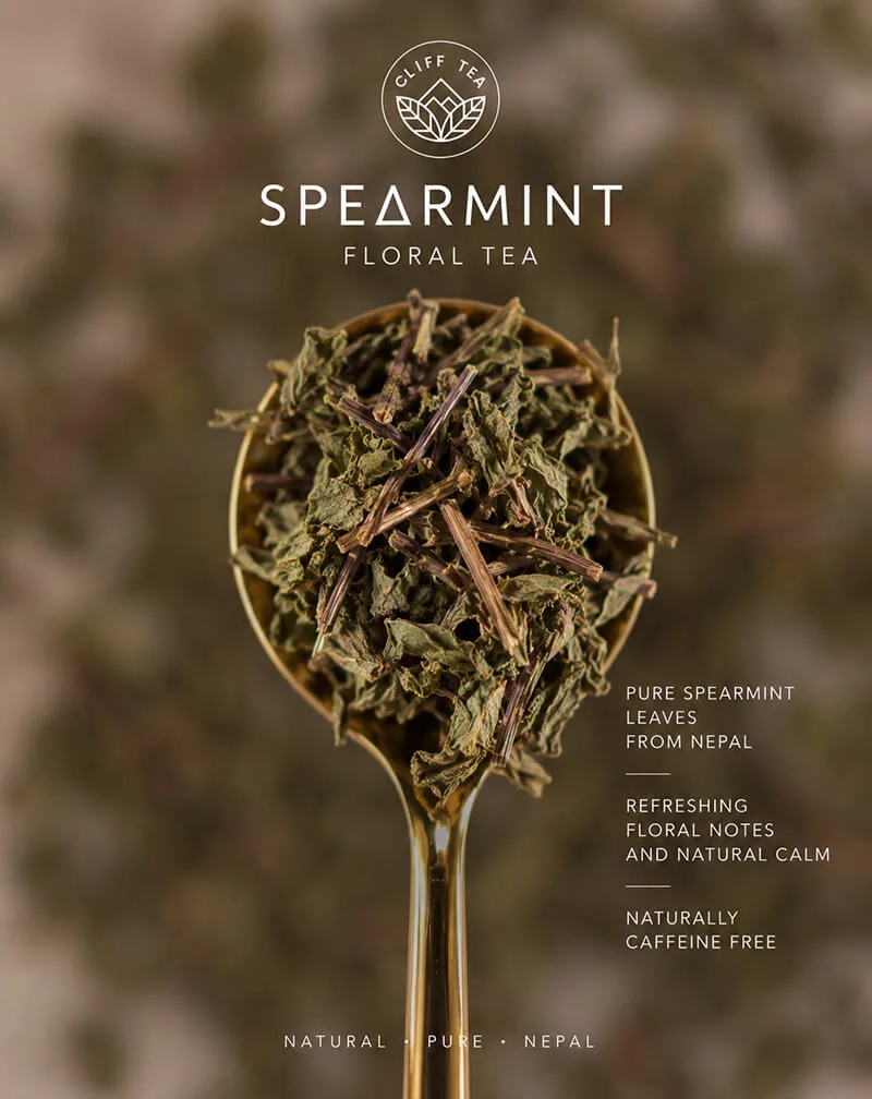 Dried spearmint leaves brewing in a clear glass cup