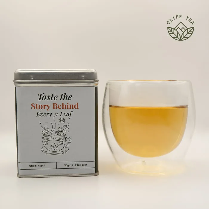 Dried spearmint leaves brewing in a clear glass cup